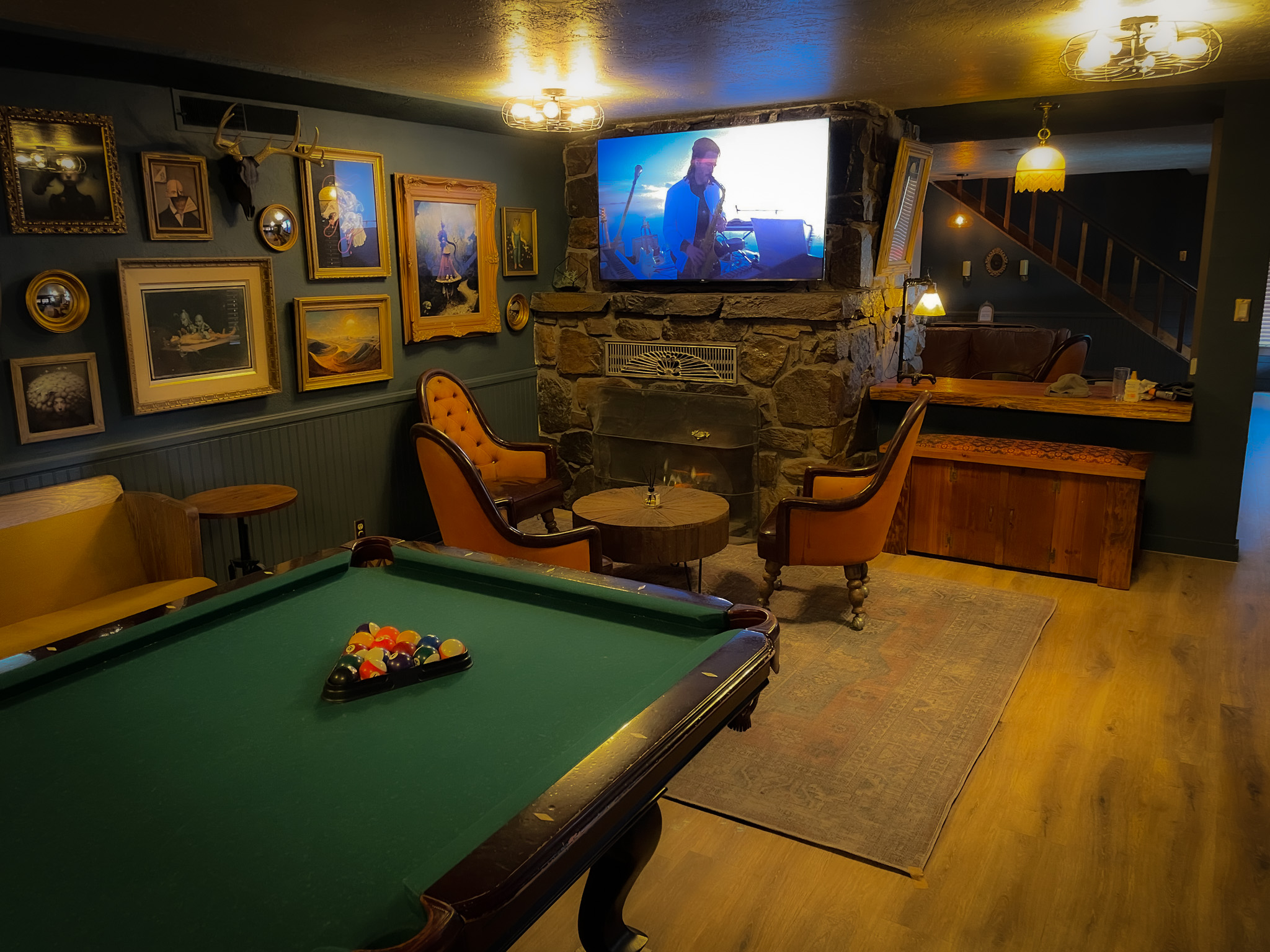 Firepit Lounge with Couch, TV, Decor, and Pool Table at Big Bear Lake Resort