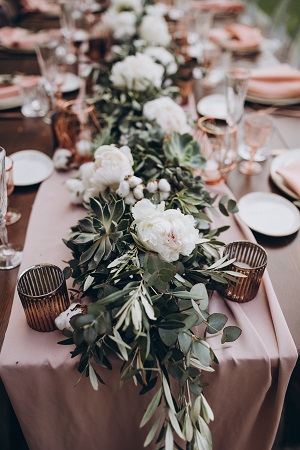 in the backyard of the villa in Tuscany there is banquet wooden