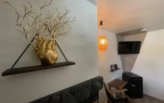 Elegant Gold Vine Decor on Floating Shelf & Chair Table - Big Bear Lodge