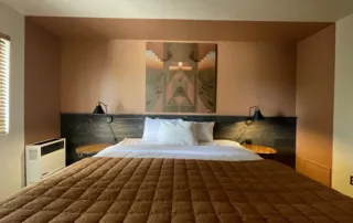 King bed with dual nightstands and AC in Big Bear Lodging